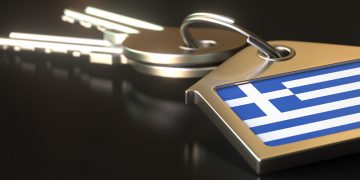 Keys and house keychain with flag of greece. national property rental or real estate market concepts.   3D rendering